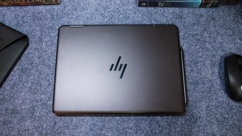 The laptop sitting closed on a desk.