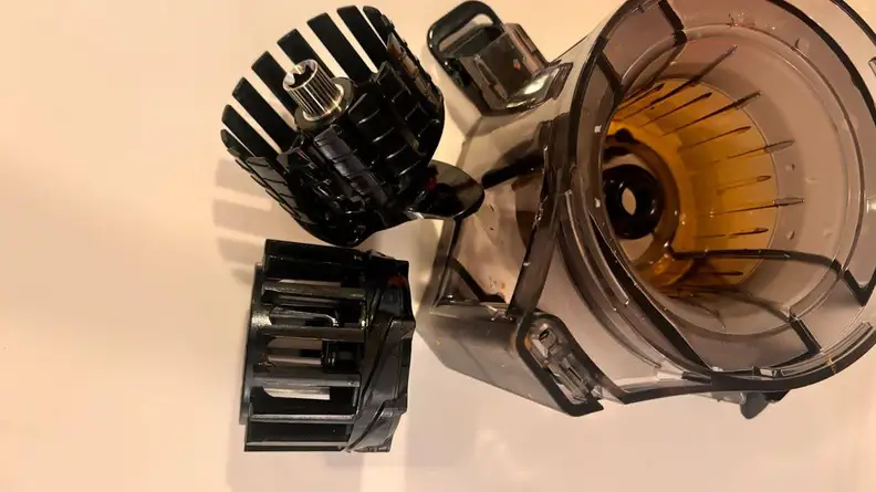 The Omega Effortless Batch Juicer deconstructed to get a closer look at each part.