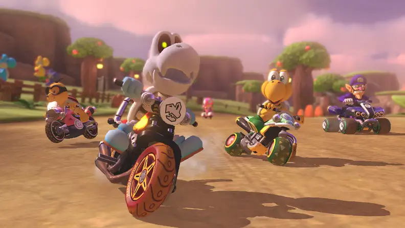 A bunch of characters from the Mario franchise zoom by on motorcycles and go-karts.