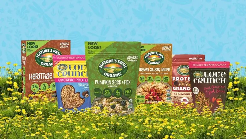 Nature's Path granola and oatmeal packages in a flowering meadow