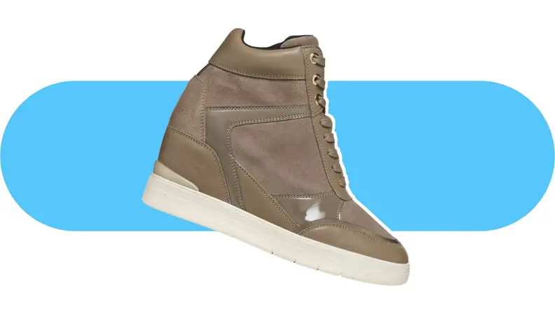 A beige wedge sneaker with leather details.