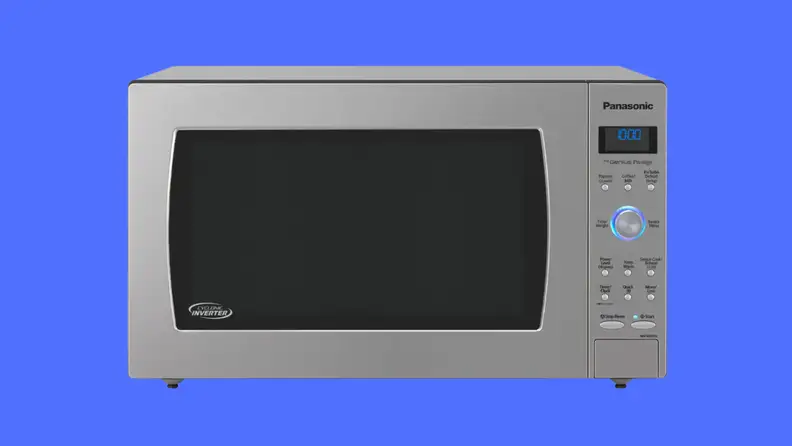 A black microwave on a blue background