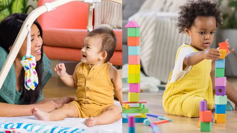 Toddlers playing on floor with block set.