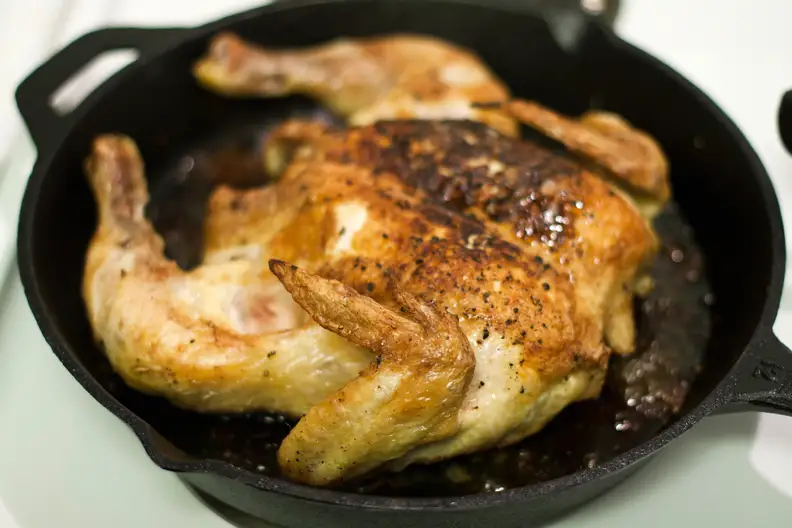 cast iron skillet with chicken