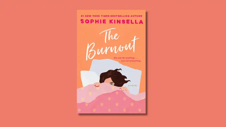 An image of the cover of "The Burnout" by Sophie Kinsella, featuring a young woman under pink bedcovers, peeping out over the edge.