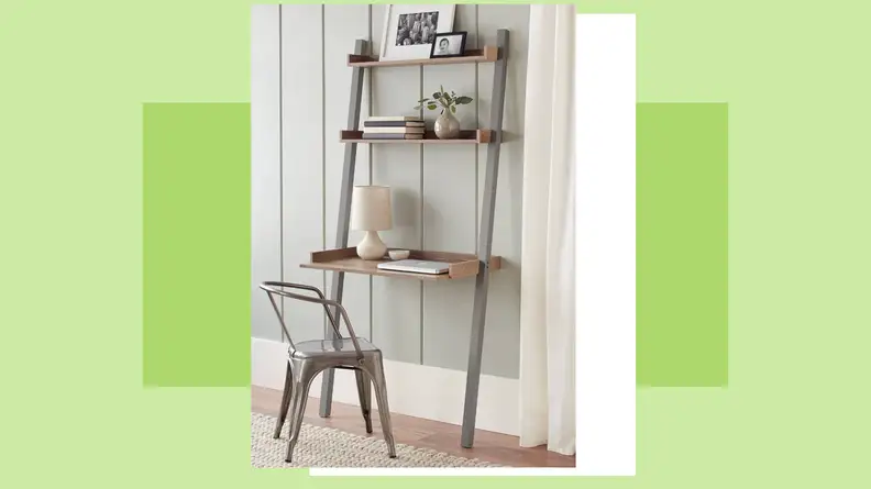 Leaning desk and chair placed against wall in residential home.