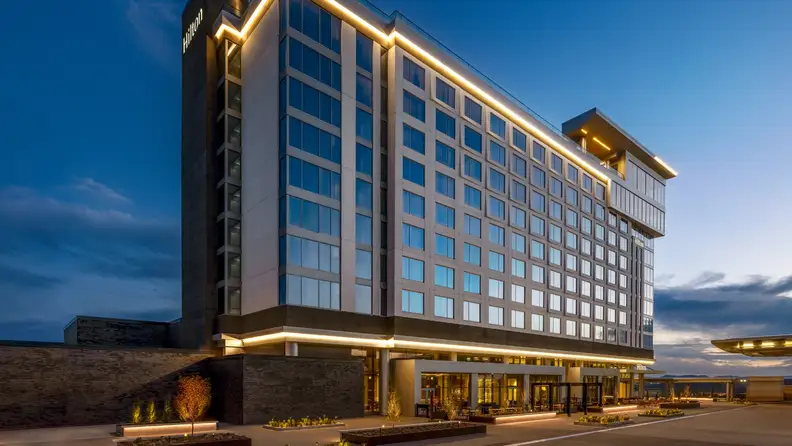 A hotel lit up in dusk