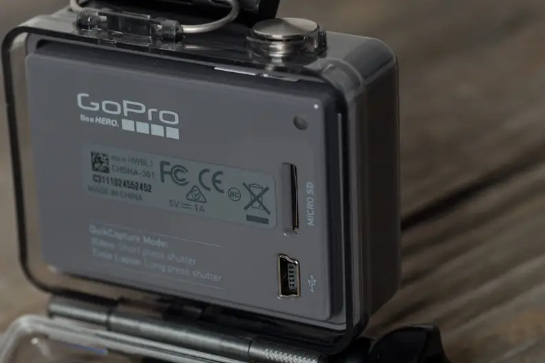 A photograph of the GoPro Hero 2014 edition's miniUSB port and microSD card slot.