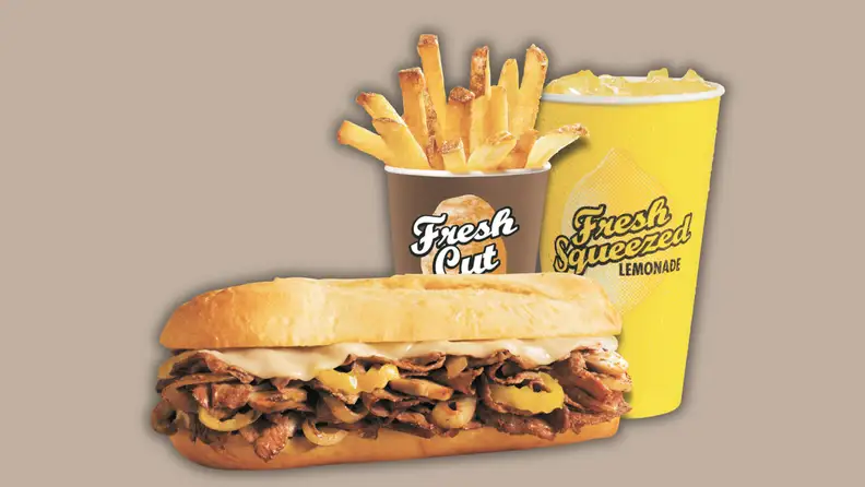 A sandwich, fries and a drink