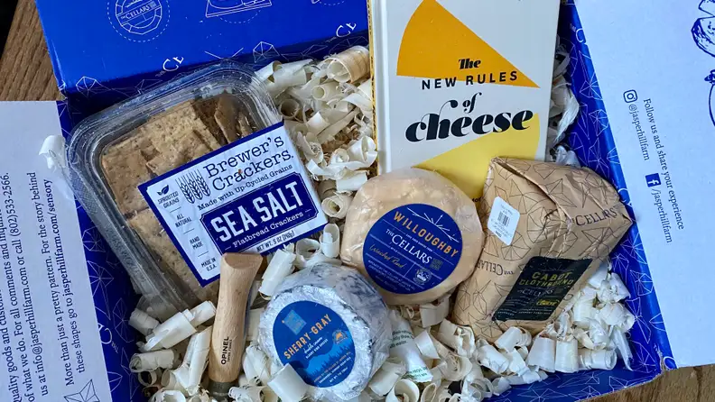 November's cheese club box included three cheeses, a book, a handy pocket knife, and my favorite crackers.
