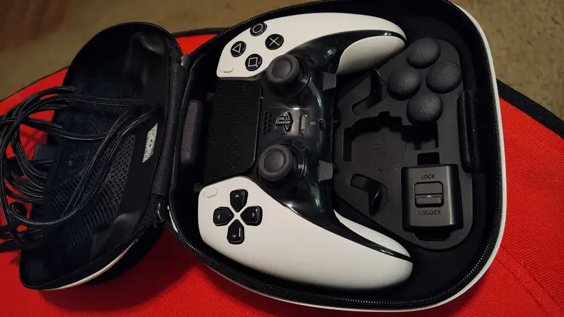 The Sony DualSense Edge controller inside a black case with accessories.