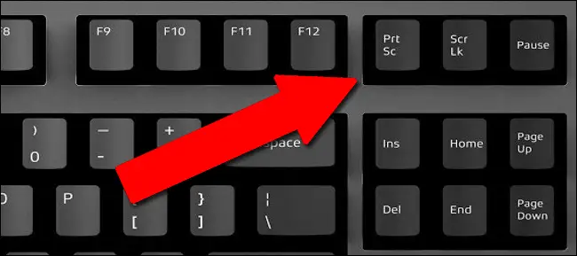 To capture a screenshot of your whole screen and save it to the clipboard so you can paste it later, press the Print Screen key on your keyboard