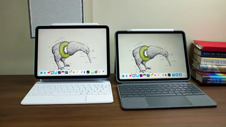 The M1 iPad Air next to the M1 iPad Pro, both in keyboard cases.