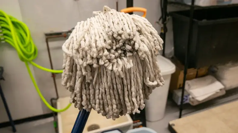 The Casabella spin mop’s head sits in the center of the frame.