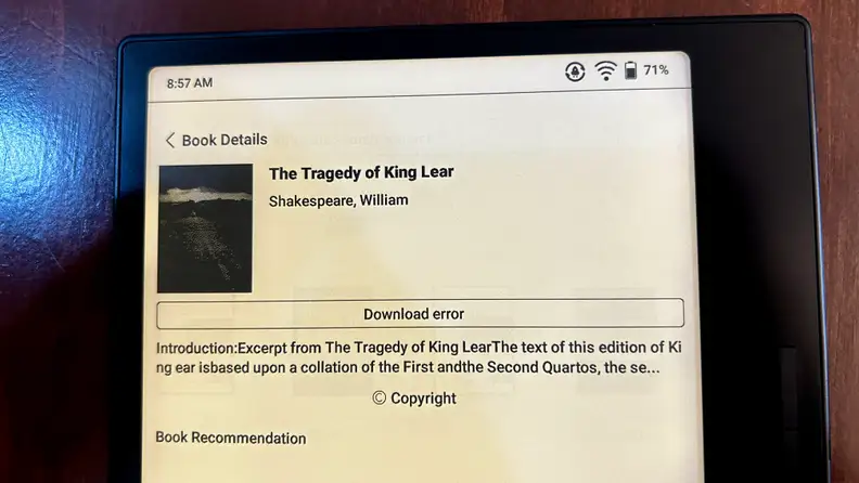 The Onyx Boox Page e-reader screen features a download error for a book.