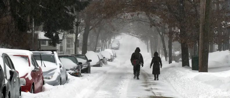 A photo of a walking couple taken during winter storm Juno.
