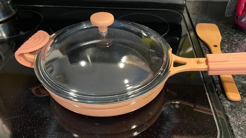 Close up of a pan with a glass lid.