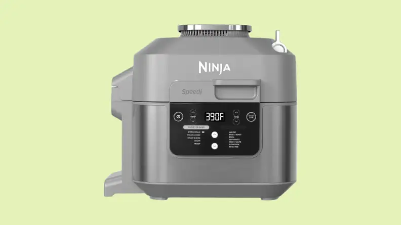 Air fryer against green background