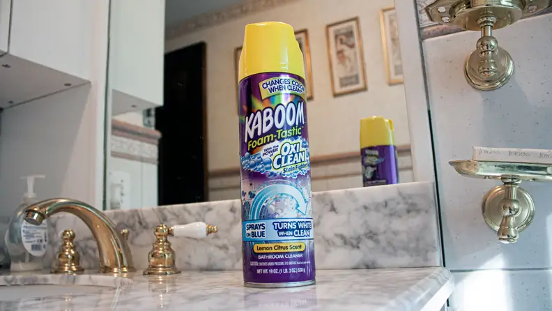 A can of Kaboom cleaner sits on a bathroom sink.