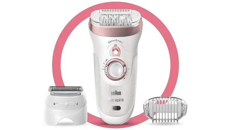 Pink and white electric braun razor in the middle of two different razor attachments, surrounded by pink ring