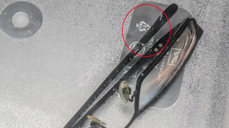 It's a little hard to see here, but when we placed our glasses into with the Sonic Soak, plumes of gunk came off.