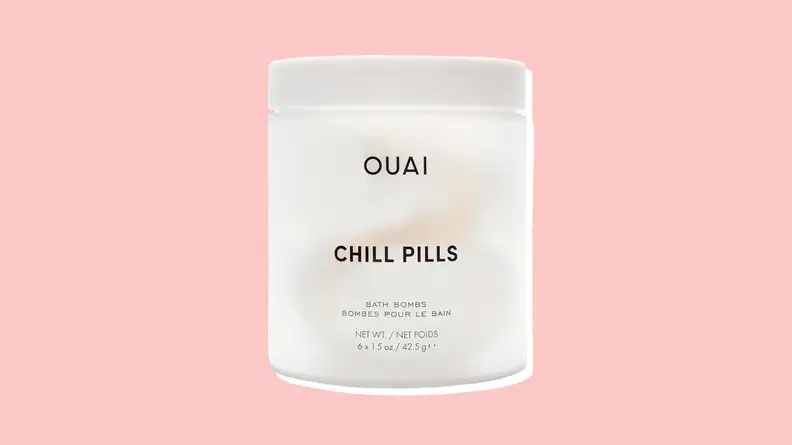 Ouai Chill Pills against a pink background.
