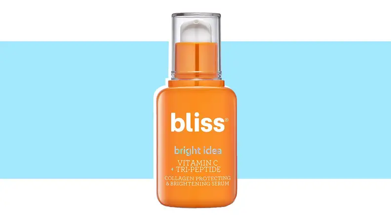 A bottle of vitamin C serum against a blue background.