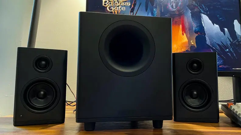 Three of the NZXT Relay Speakers and Relay Subwoofer's side-by-side in the color black and the little bookshelf speakers in particular are also beautifully designed.