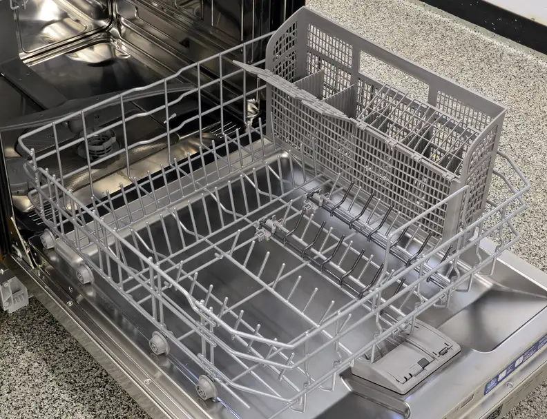 The lower rack slides in and out quite easily, and it also comes with two half rows of grey folding tines. The full-depth cutlery basket is one large unit piece.