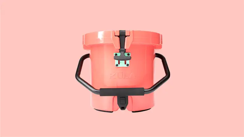 A pink cooler with a black handle and dispenser.