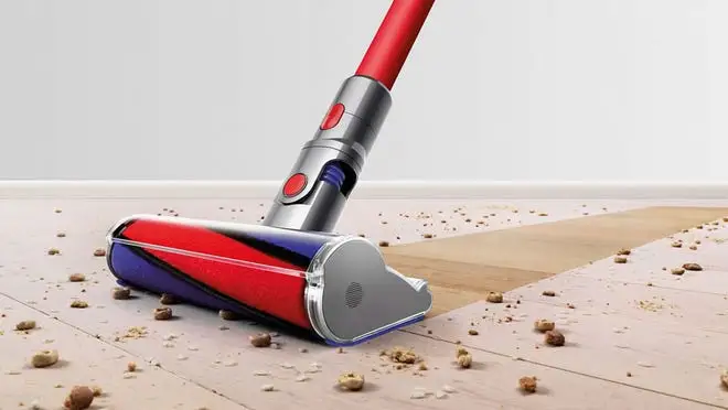 A Dyson vacuum sucks up spilled cereal.