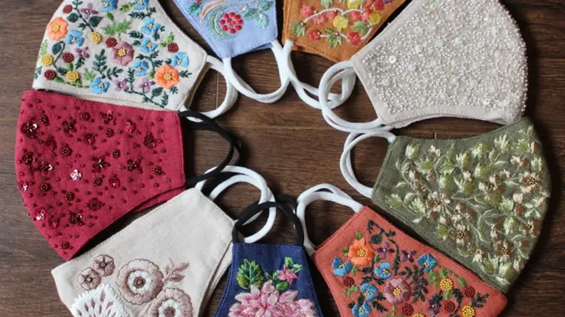 embroidered face masks placed in a circle