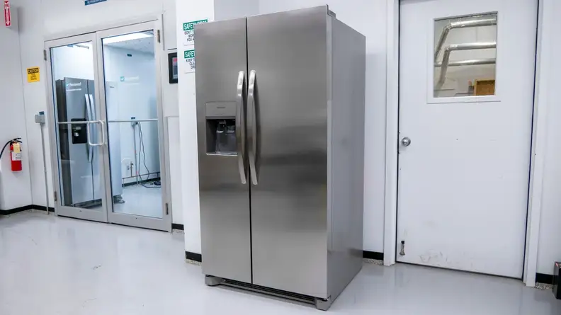The Frigidaire FRSS2623AS side-by-side refrigerator sitting outside of our fridge testing labs.