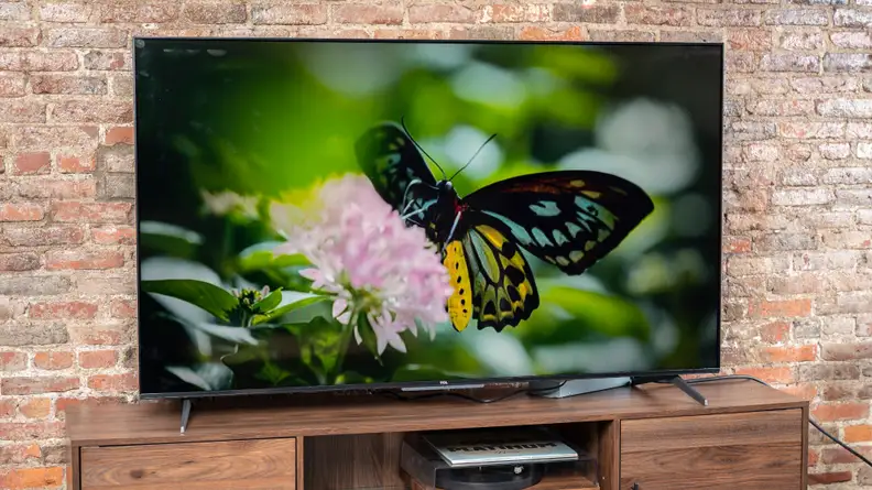 The TCL 5-Series with Google TV displaying 4K content in a living room setting