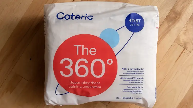 Package of Coterie The 360 training underwear on a wooden surface.