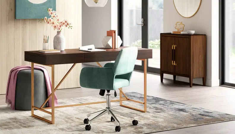 Trendy home office with green statement chair.