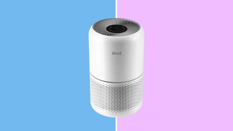 The Levoit air purifier on a blue and purple background