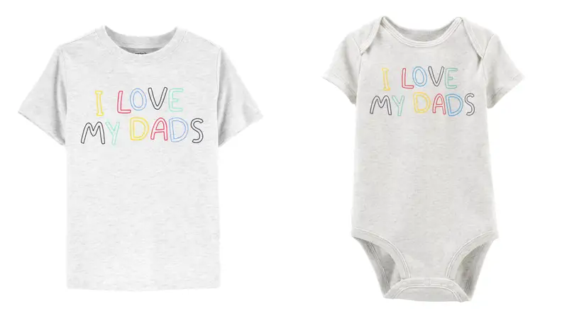 A grey tshirt with rainbow lettering that say I love my dads, next to a baby's onesie in the identical style