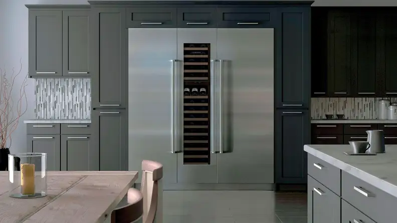 The Sub-Zero IC30RRH column refrigerator, installed in the far wall of a modern kitchen.