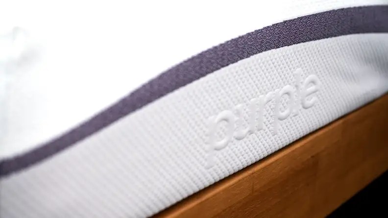 the embossed name on the side of the Purple Mattress