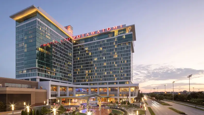 A view of a casino hotel on one side during sunset