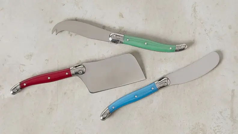 This Laguiole cheese knife set includes a cleaver, spreader, and a soft cheese knife.