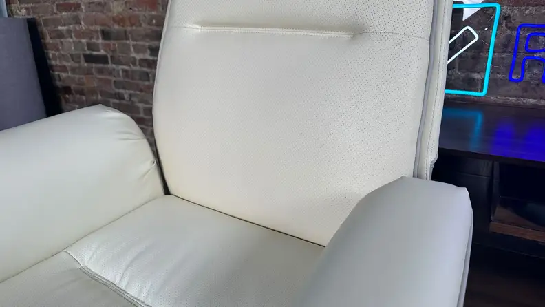 A close-up of the lumbar support region of the chair. You can see a small bump across the back of the chair, but it isn't particularly pronounced.