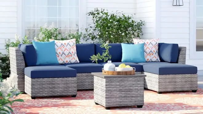 Wicker couch outdoors on patio.
