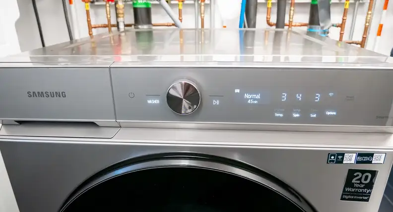 Shot of the control panel with buttons and knobs on the Samsung WF53BB8700AT Front-load Washing Machine.