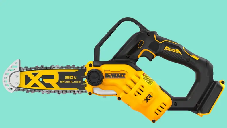 A close-up of the DCCS623B Dewalt mini chainsaw floating above a seafoam green background.