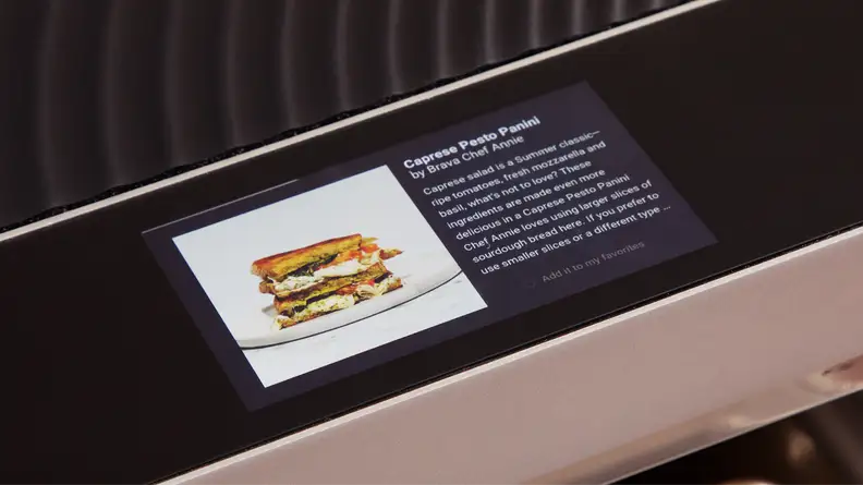 A closer view of the Brava Glass oven's touchscreen featuring a recipe for a caprese pesto panini.