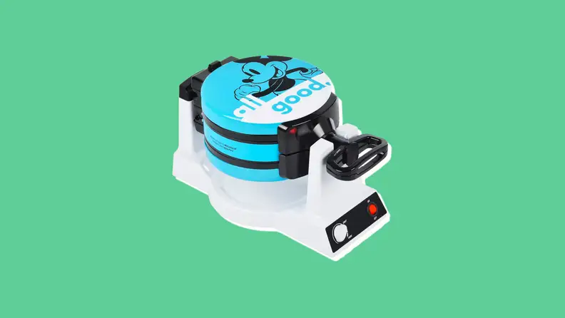 A blue waffle iron with a cartoon picture of Mickey Mouse and the words "All Good" on it.