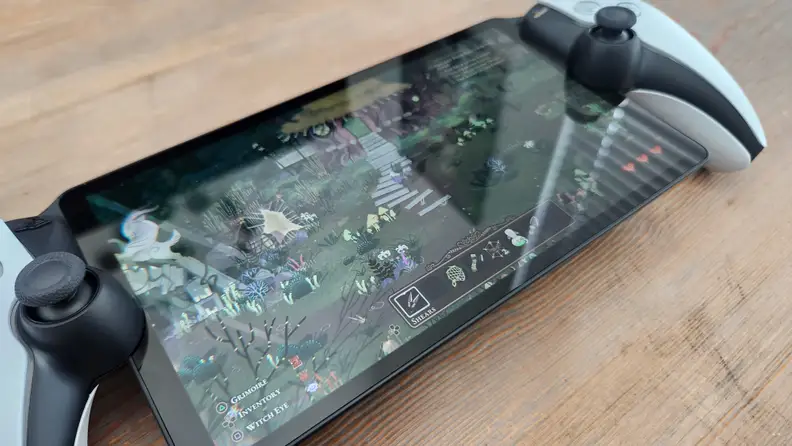 A close up of sunlight glare on the  small LCD screen of the playstation portal.