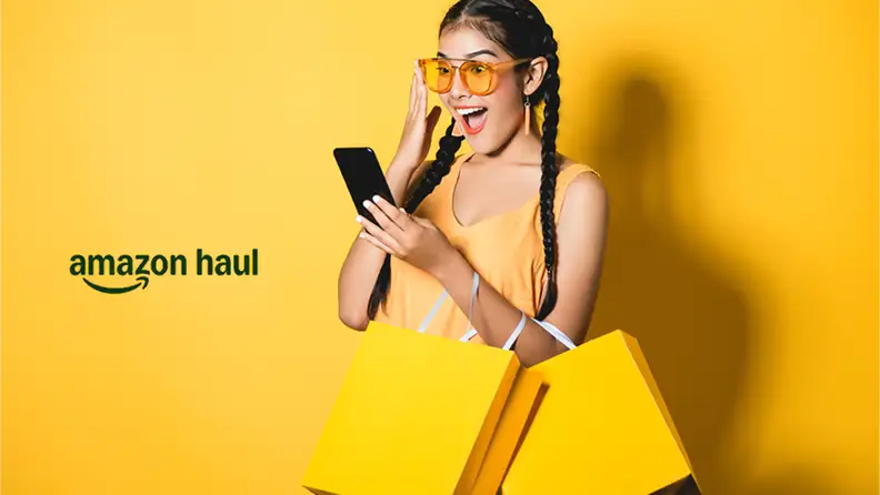 A young woman wearing yellow sunglasses and holding a smartphone, surrounded by yellow shopping bags and a yellow background with the Amazon Haul logo.